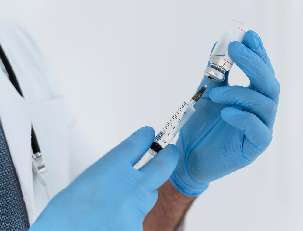 doctor-holding-syringe-close-up_23-2148755631-min.jpg